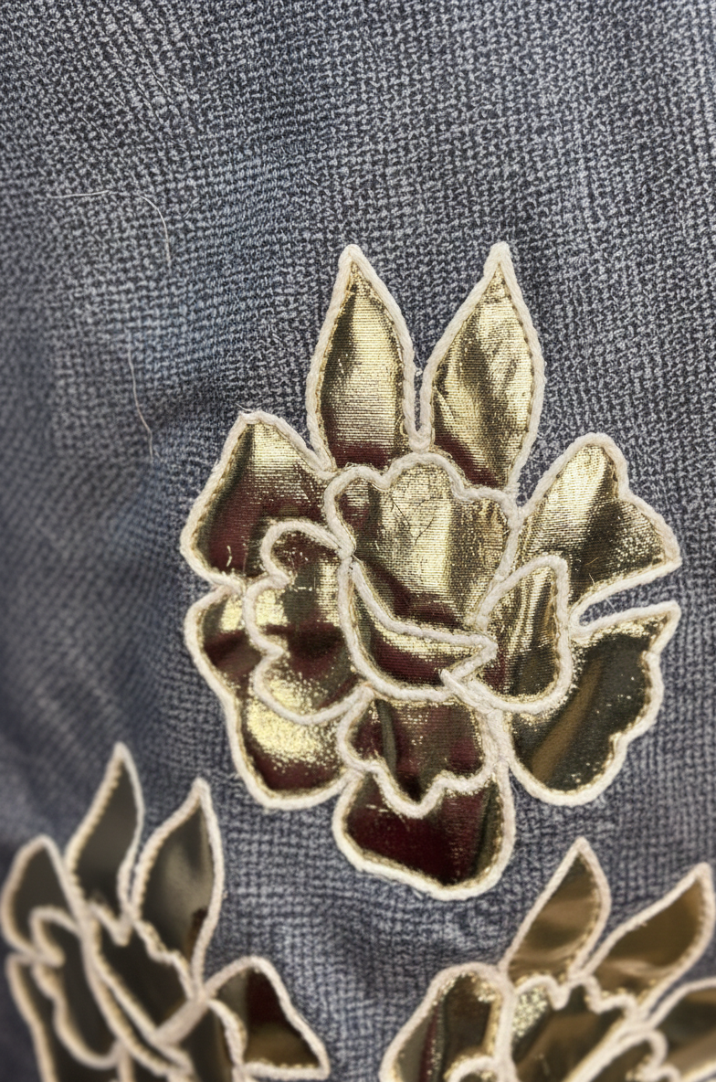 Close-up of a floral embroidery patch on fabric