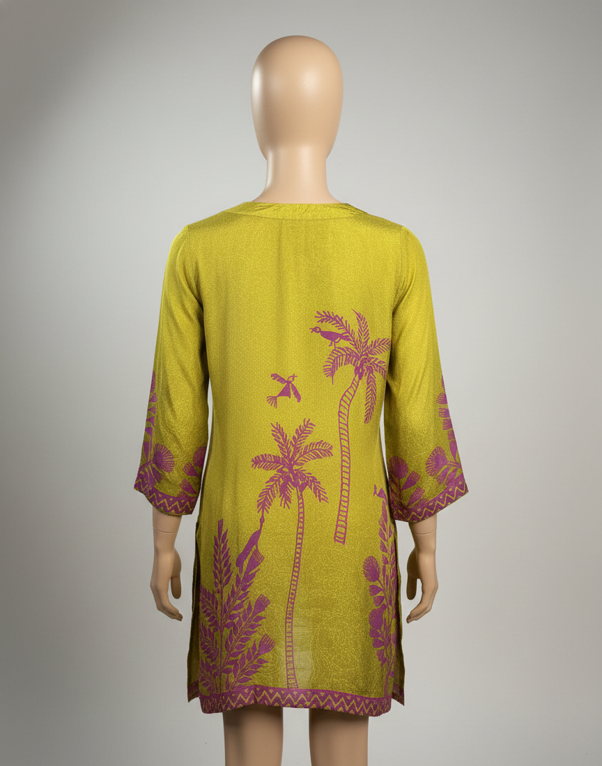 Mannequin wearing a green dress with pink floral patterns on a gray background