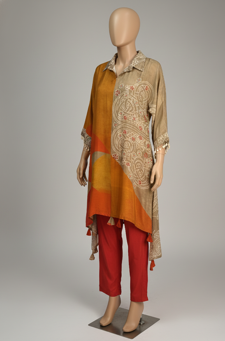 Mannequin wearing a patterned top and red pants on a gray background