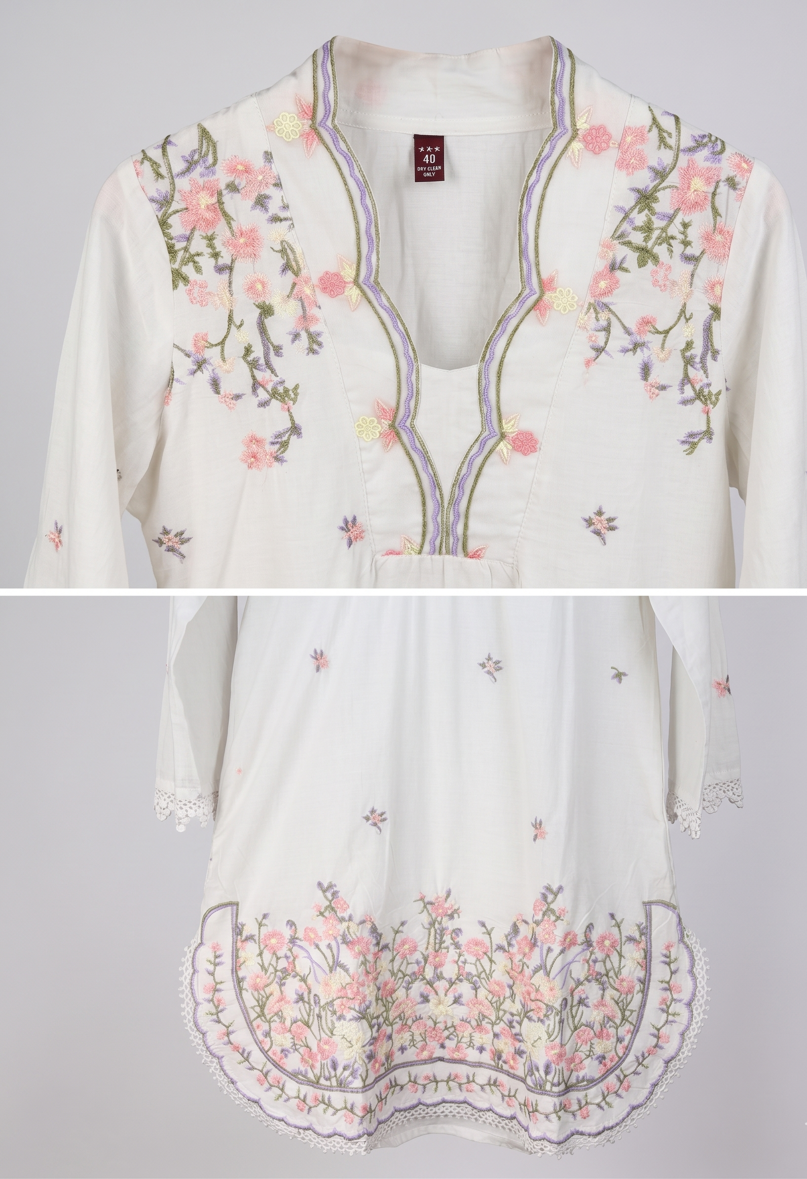 White blouse with floral embroidery on a gray background