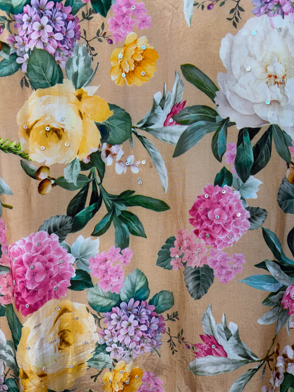Floral pattern with pink, yellow, and white flowers on a beige background
