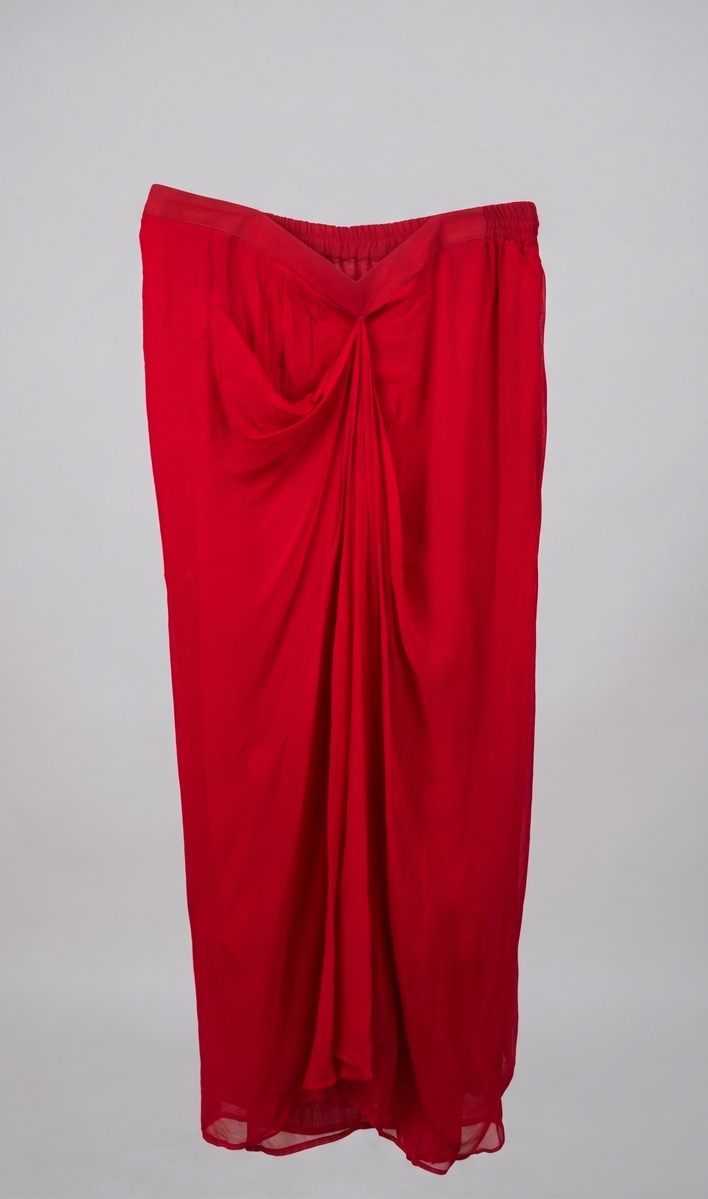 Red draped skirt on a plain background